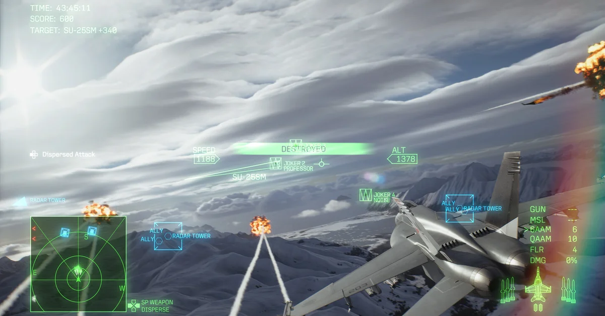 A jet banking over snowy mountains as targets explode, with the Dispersed Attack wingman command on the HUD in Ace Combat 8: Wings of Theve