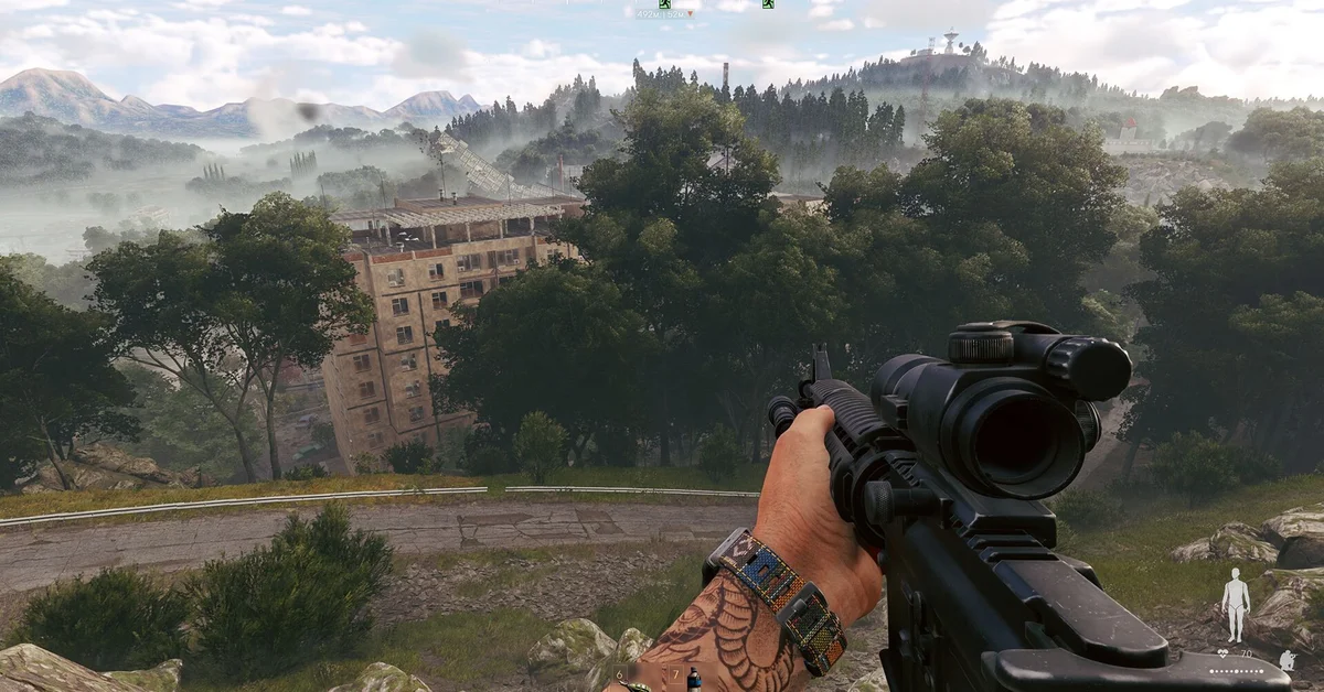 A scoped rifle overlooking misty hills and an abandoned apartment block in Active Matter