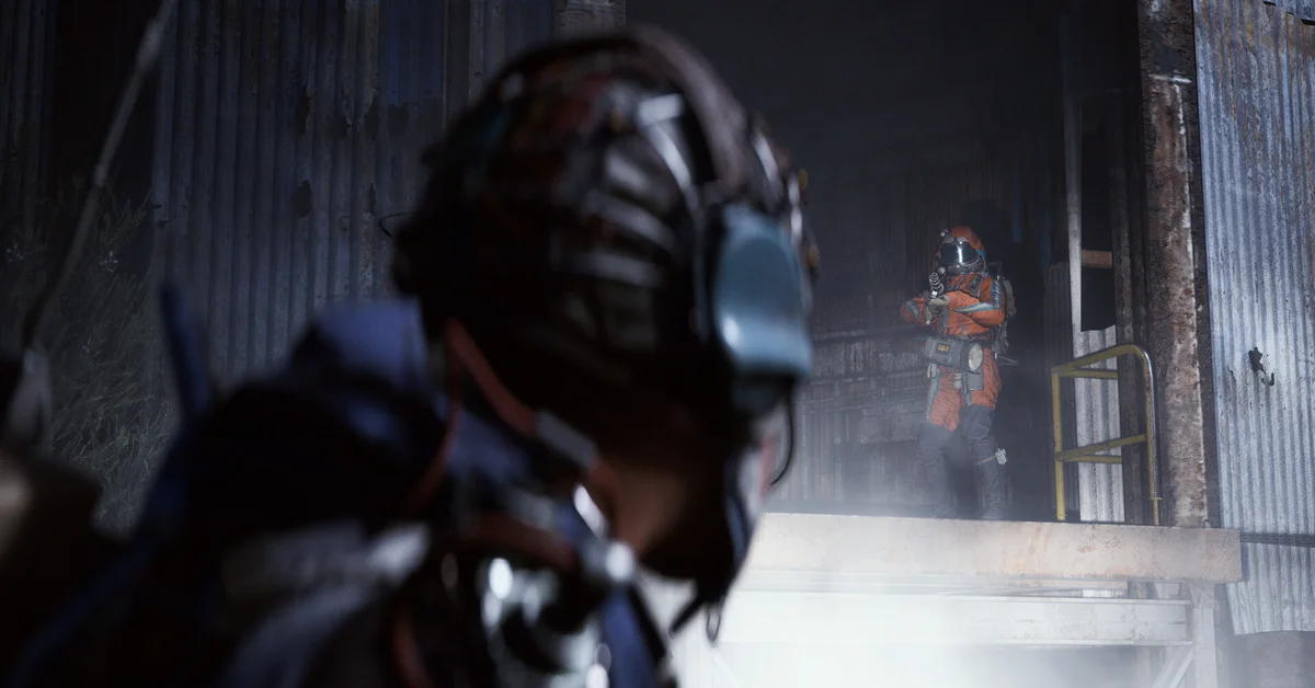 An Arc Raiders raider in an orange suit aiming from a doorway as another player watches in the foreground