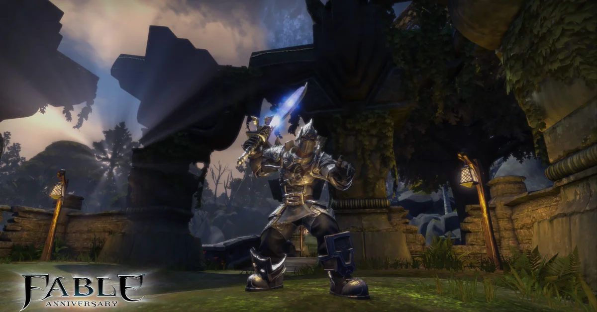 An armored Hero raising a glowing blue sword among ruined stone arches in Fable Anniversary