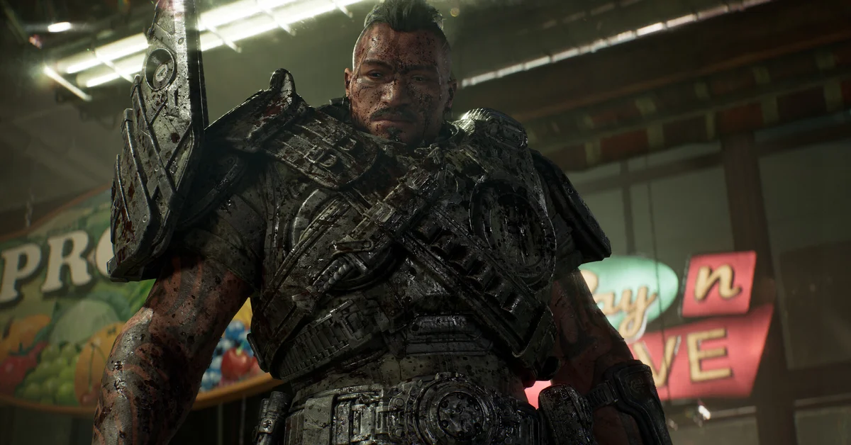 A bald COG soldier in heavy armor stands in a ruined shopping arcade lit by neon signs in Gears of War E-Day
