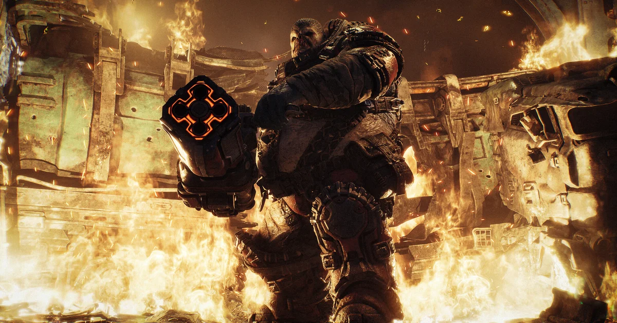 A hulking Locust Boomer aims its heavy launcher through flames and burning wreckage