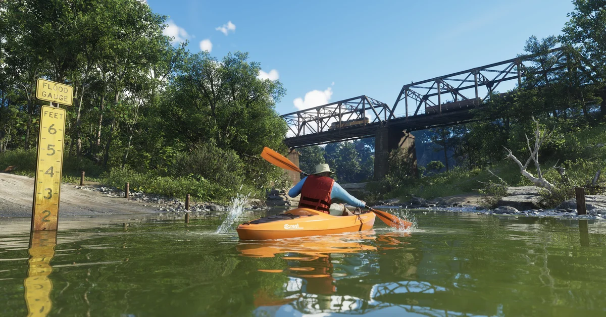 A kayaker paddles a river beneath a steel bridge in Mount Kalaga National Park in Grand Theft Auto VI