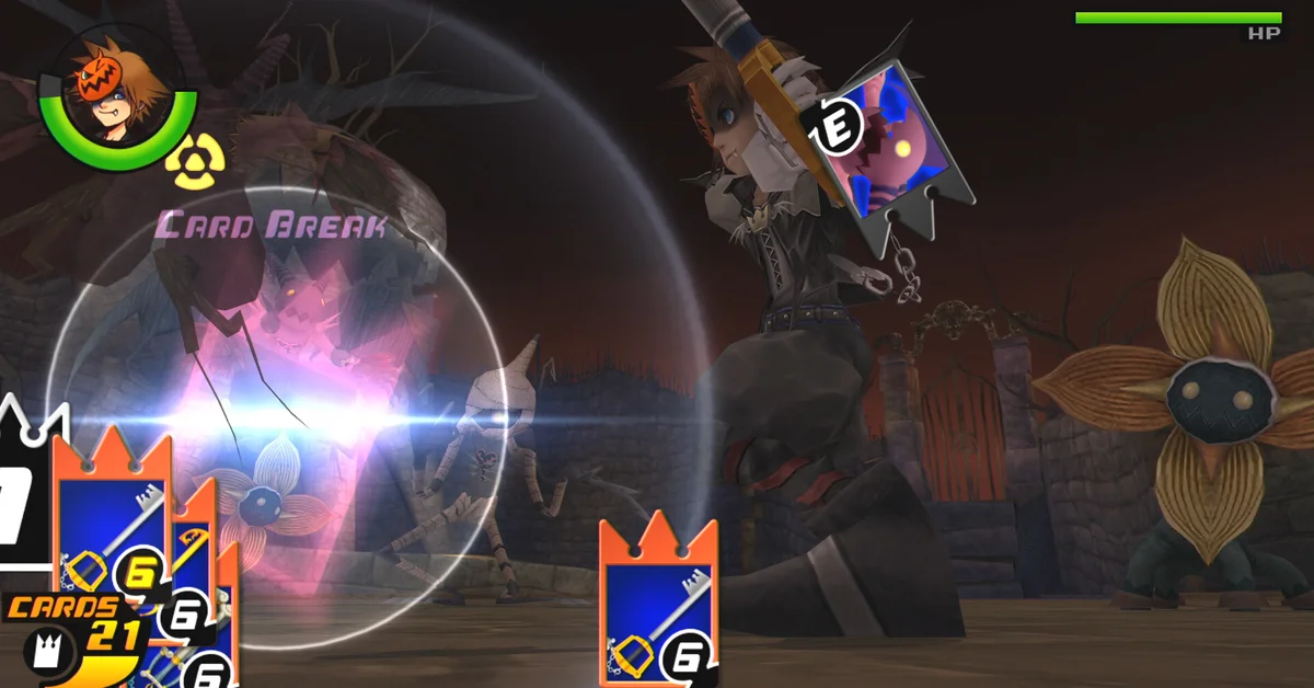 Sora breaking an enemy card during a card-based battle in Halloween Town in Kingdom Hearts Re:Chain of Memories