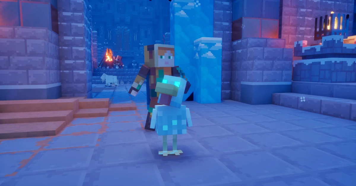A Minecraft Dungeons II hero beside a pale blue creature in a frosty stone ruin lit by a campfire