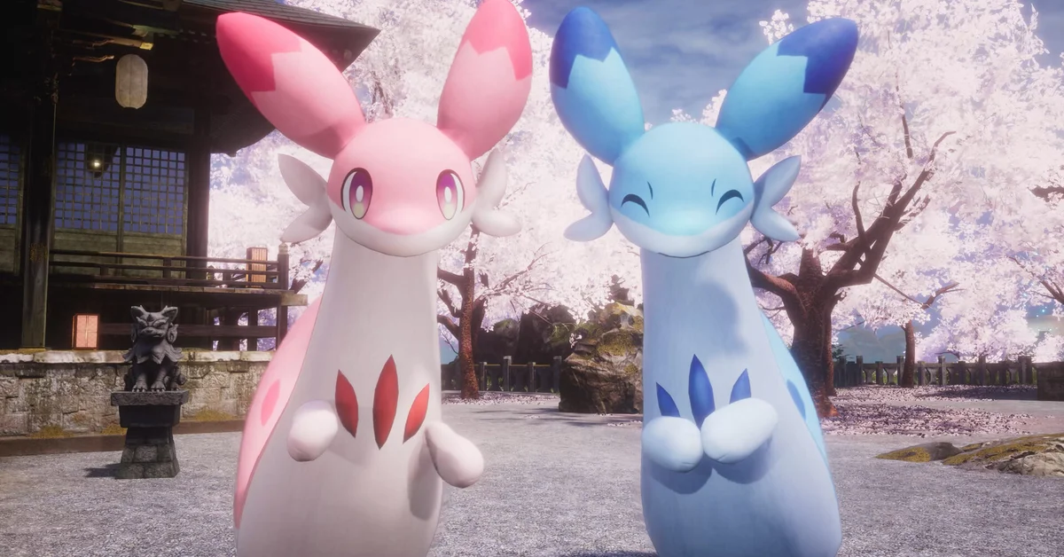 Two long-eared Pals, one pink and one blue, standing in a shrine courtyard under cherry blossom trees in Palworld