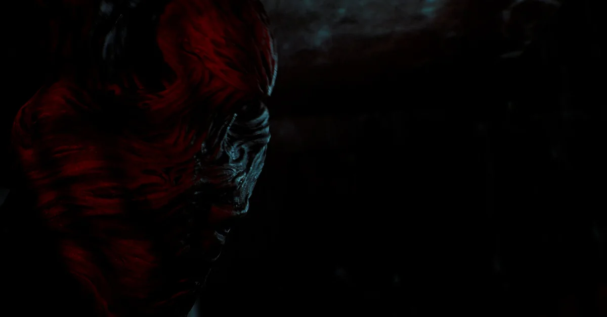A twisted monster face emerging from darkness in Silent Hill Townfall