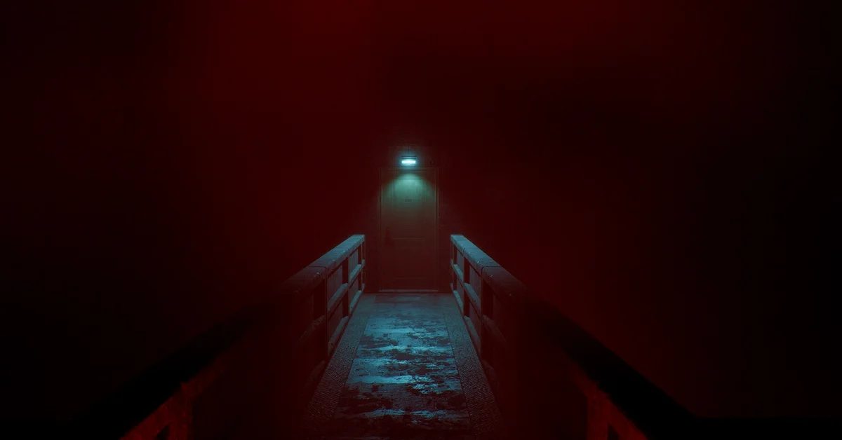 A narrow walkway leading to a lit door in a red-lit corridor in Silent Hill Townfall