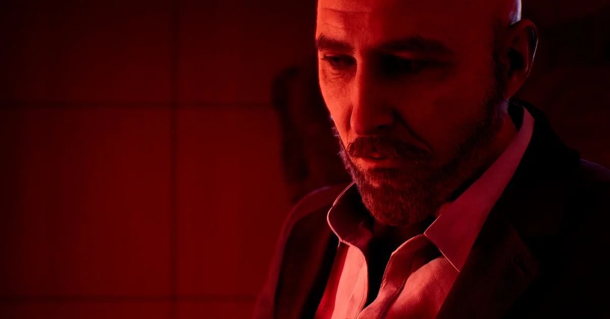 Richard lit in deep red, looking down, in Silent Hill Townfall