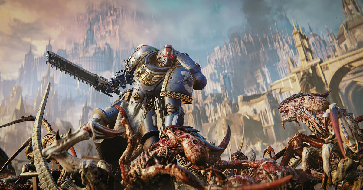 An Ultramarine swings a chainsword through a horde of Tyranids in Warhammer 40,000 Space Marine 2