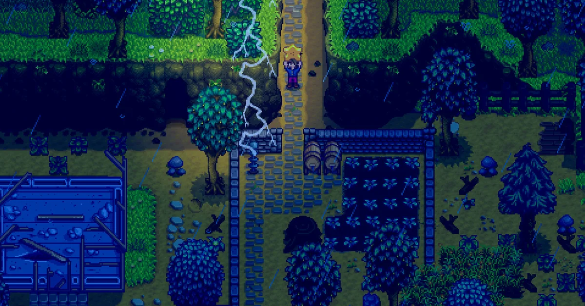A Stardew Valley farmer holds an item overhead on a stone path during a nighttime thunderstorm, beside two kegs and a fenced crop plot