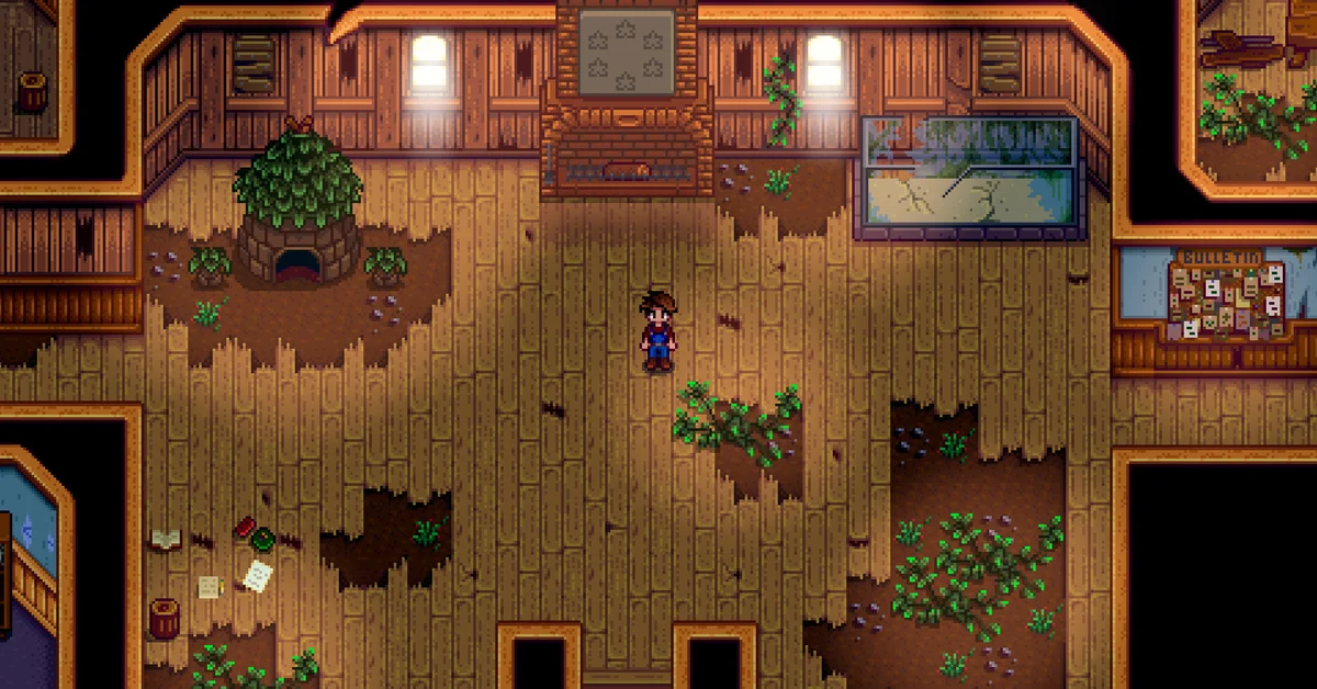 The farmer standing inside the run-down Community Center in Stardew Valley, with broken floorboards, weeds, an empty fish tank and the bulletin board