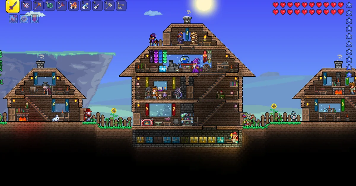 A Terraria player standing in a village of wooden NPC houses under a bright sun