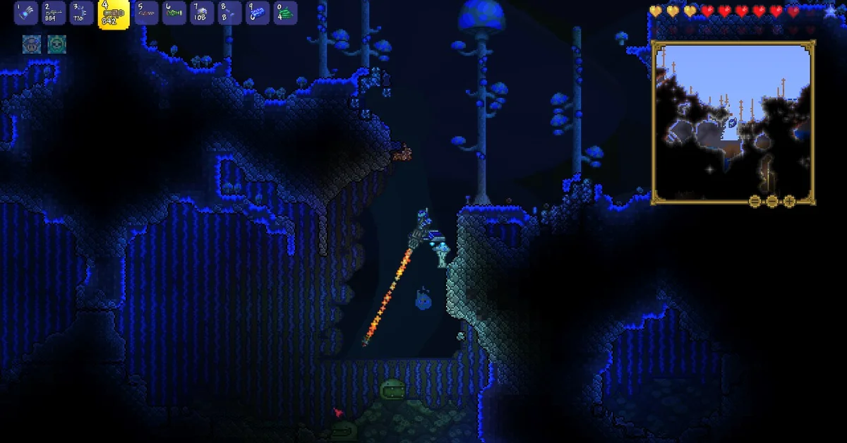 A Terraria player flying up through a glowing blue mushroom cave, with the minimap open in the corner