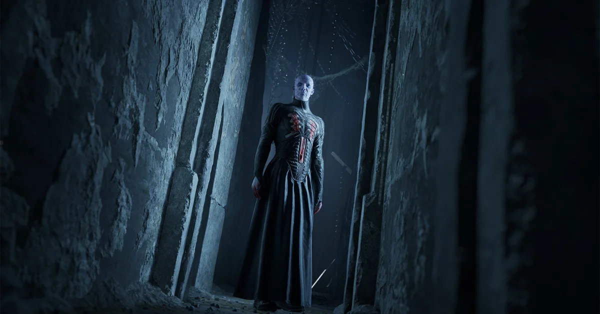 A robed figure in a dark stone hall in Clive Barker's Hellraiser Revival