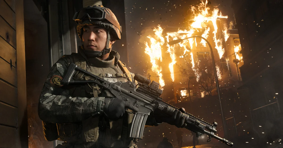 A soldier in front of a burning building in Call of Duty Modern Warfare 4