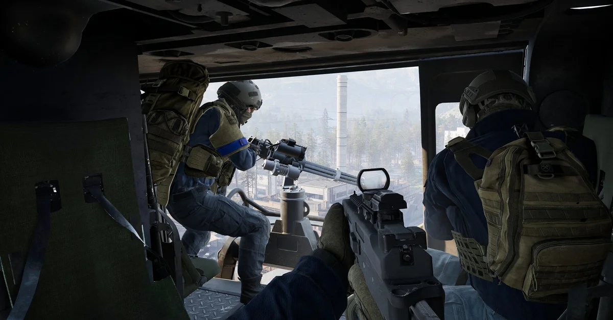 WARDOGS soldiers ride inside a vehicle with a mounted gun, looking out at an industrial town