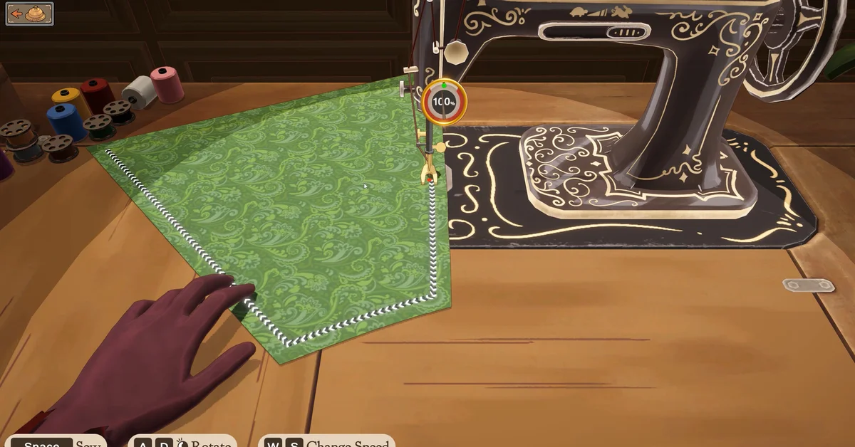 Sewing green fabric at the sewing machine in Dressmaker