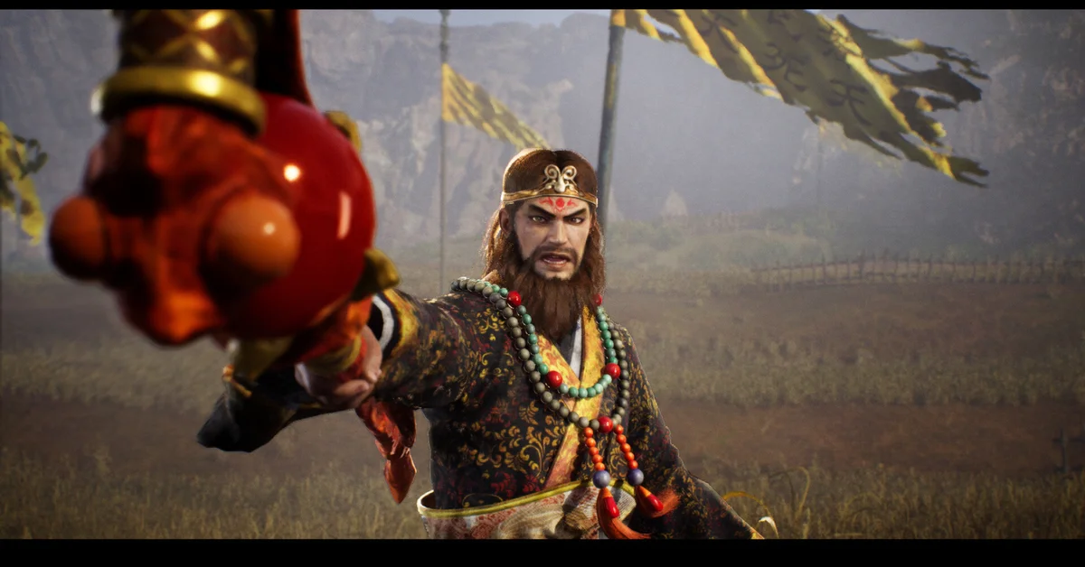 Zhang Jiao raises a red orb toward the camera on a misty battlefield in Dynasty Warriors 3 Complete Edition Remastered