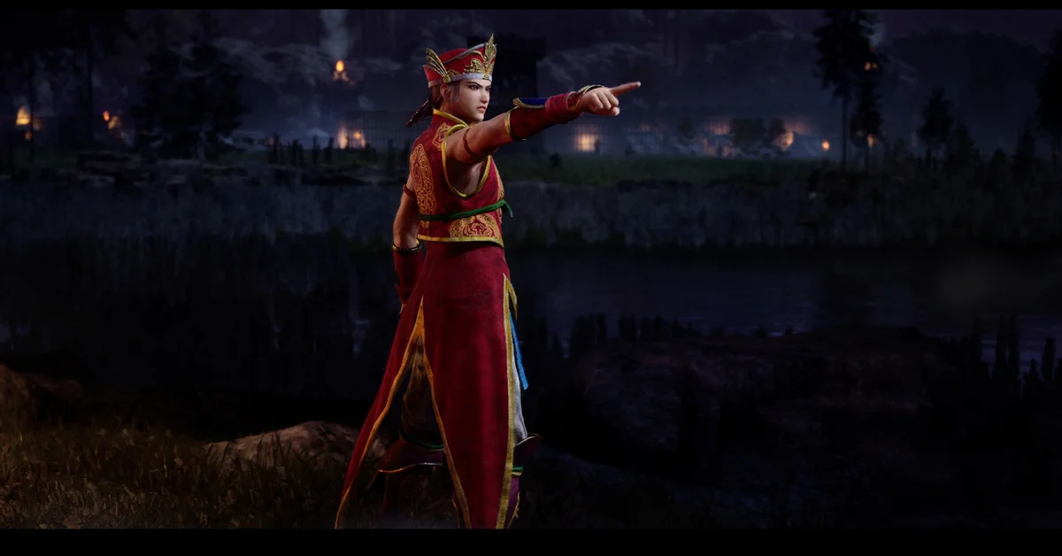 An officer in red robes points across a burning night battlefield in Dynasty Warriors 3 Complete Edition Remastered