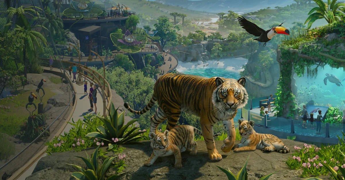 A Sumatran tiger and two cubs on a rock above a zoo with an aquarium and a flying toucan in Planet Zoo 2 key art