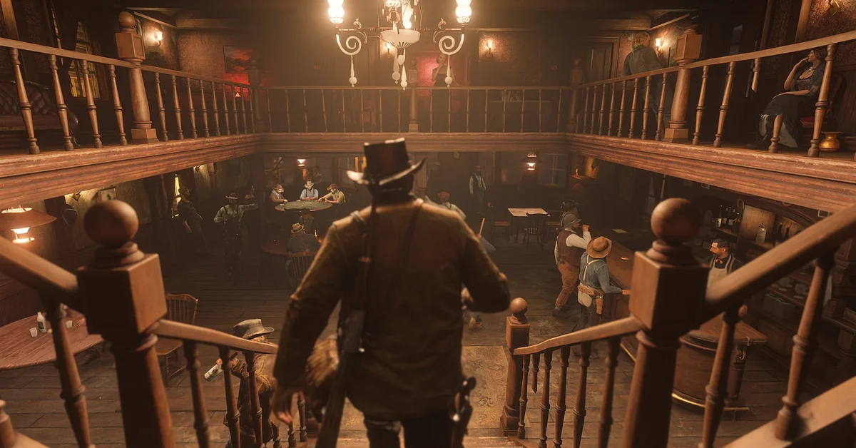Arthur Morgan walking down the stairs into a busy saloon with card tables below in Red Dead Redemption 2